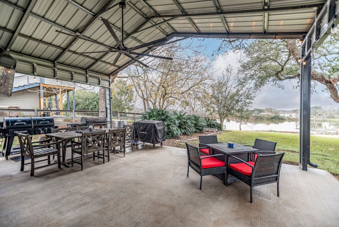 1236 Riverside Drive Palacios, TX 77465 - Photo 8 of 35 a view of a chairs and table in the patio