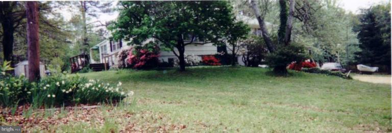 18319 Point Lookout Road Park Hall, MD 20667 - Photo 1 of 12 House is hard to find amid the landscaping