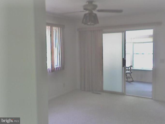 18319 Point Lookout Road Park Hall, MD 20667 - Photo 3 of 12 Dining room leads to the sun room.
