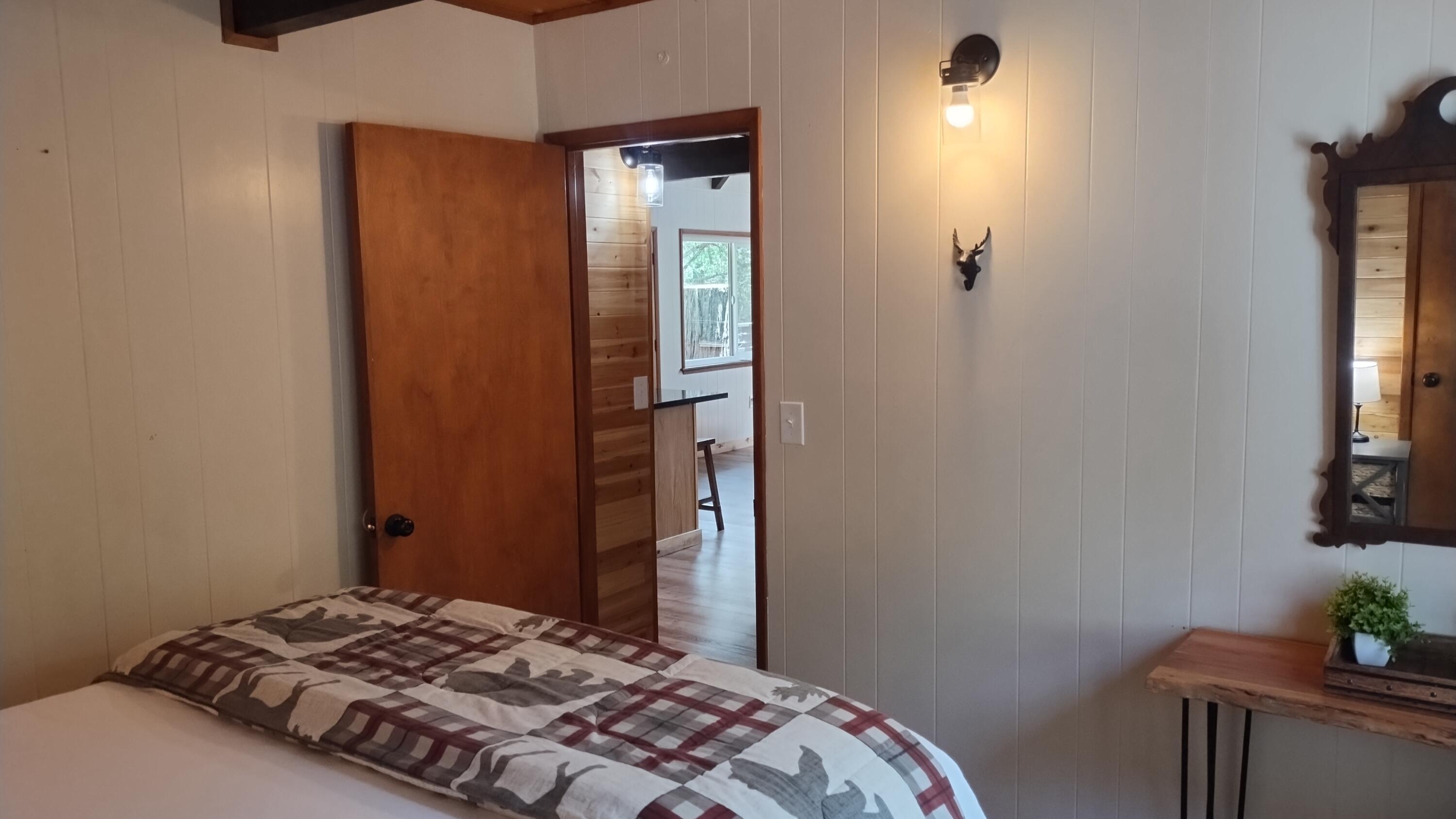 1693 Forest Rte 21S94 Camp Nelson, CA 93265 - Photo 23 of 86 a bedroom with a bed and a window