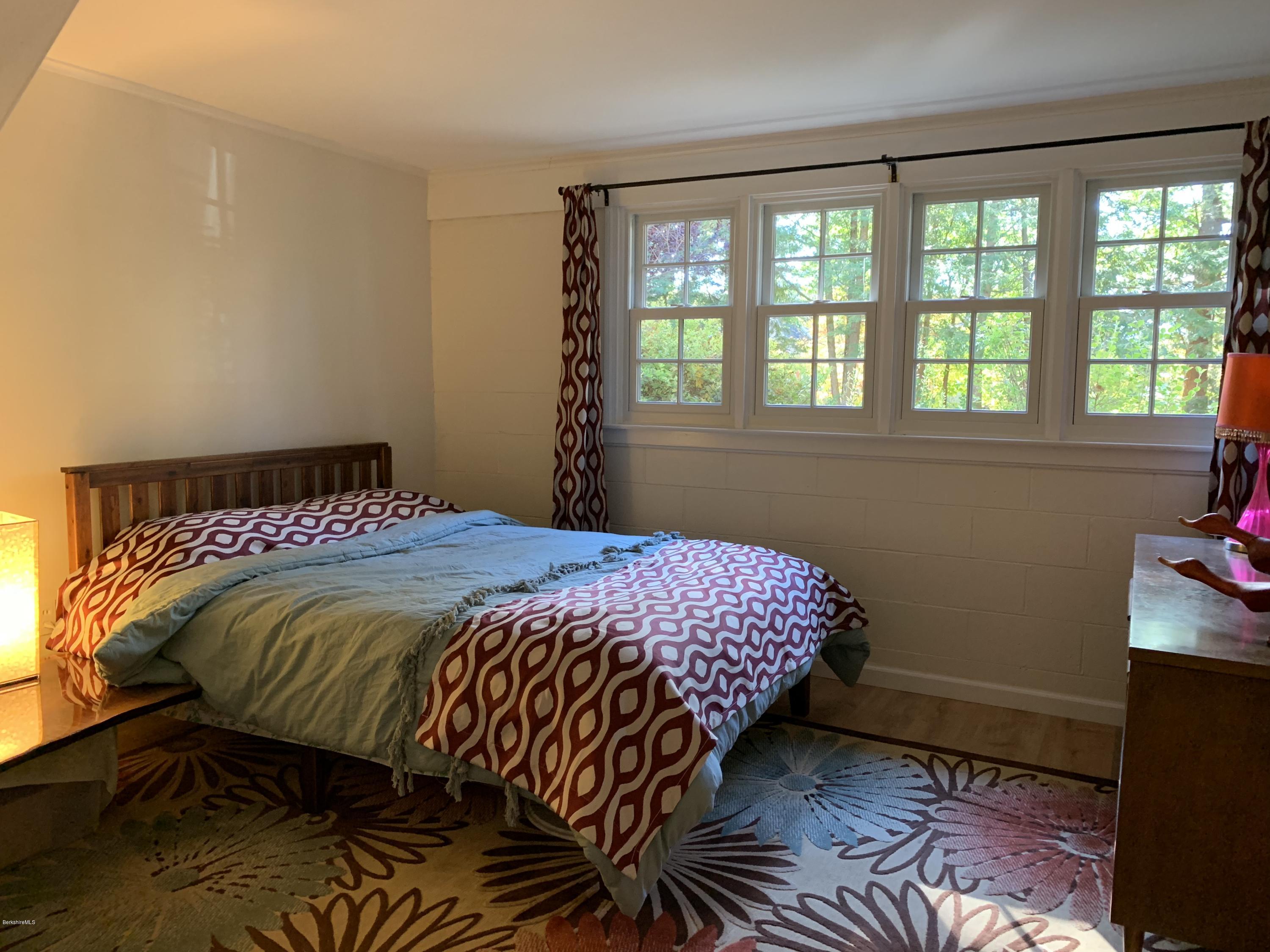 261 Old Stockbridge Road Lenox, MA 01240 - Photo 30 of 43 a bedroom with a bed and a window