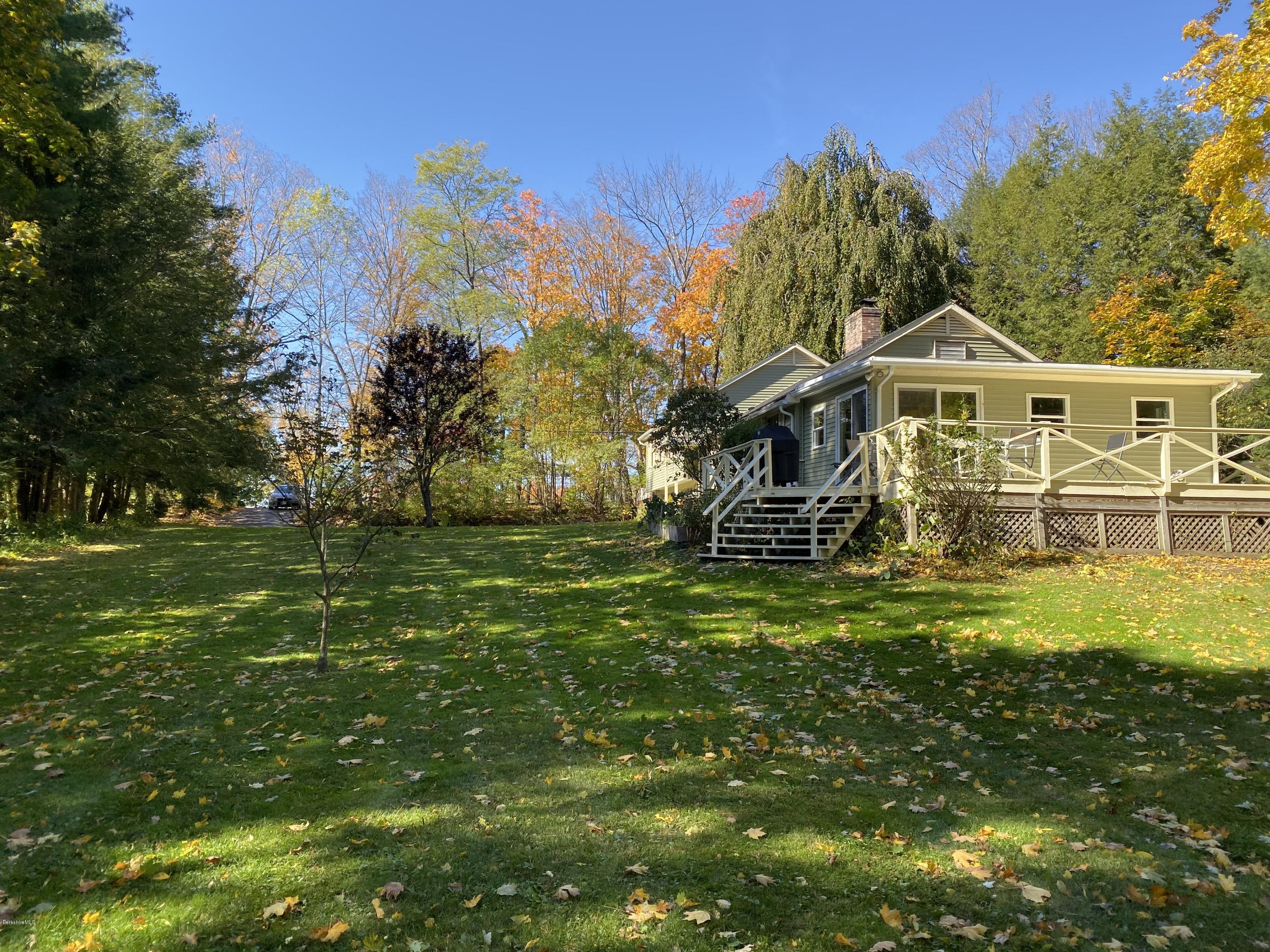 261 Old Stockbridge Road Lenox, MA 01240 - Photo 38 of 43 a front view of a house with a garden