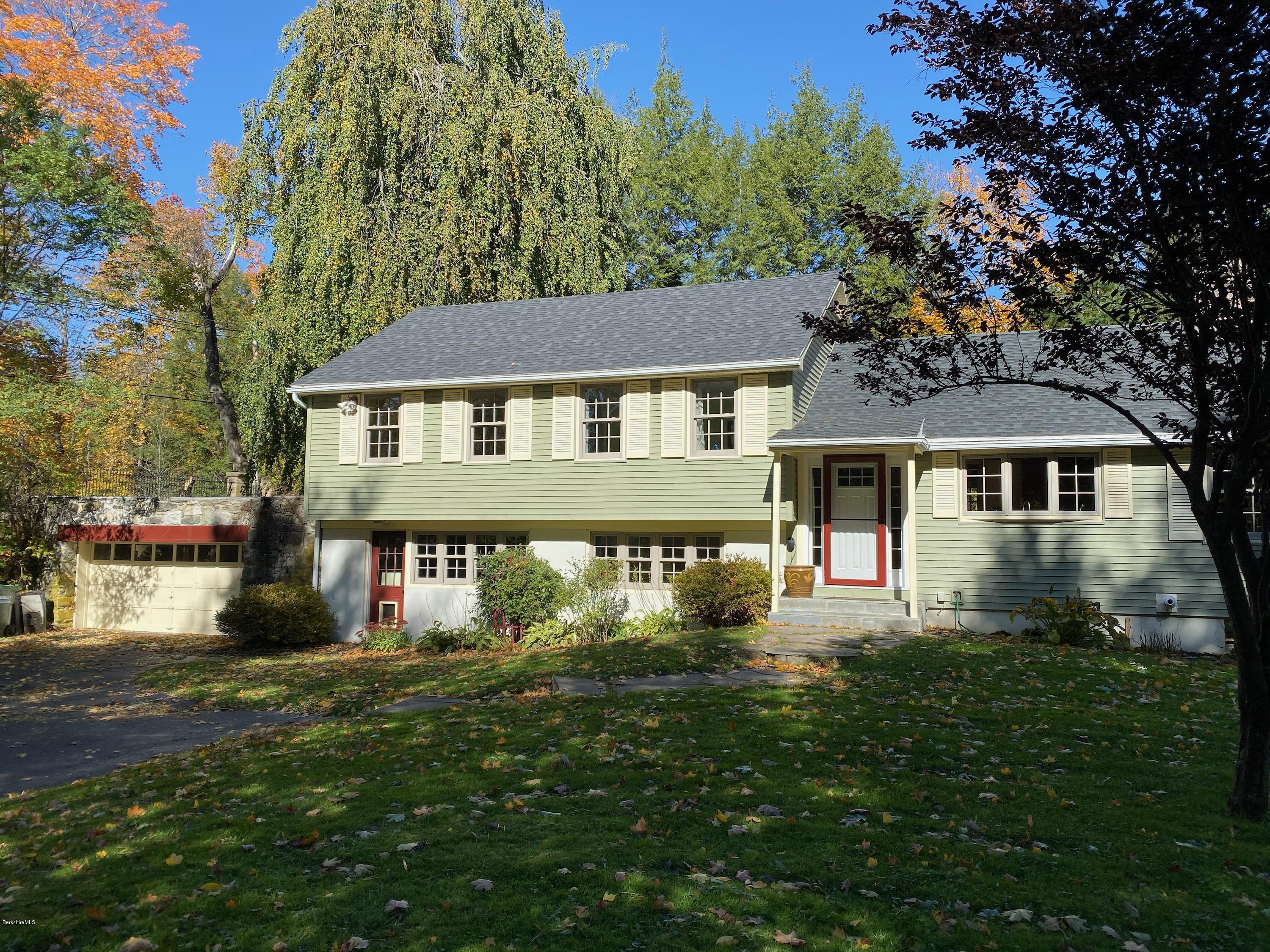 261 Old Stockbridge Road Lenox, MA 01240 - Photo 40 of 43 a front view of a house with a yard