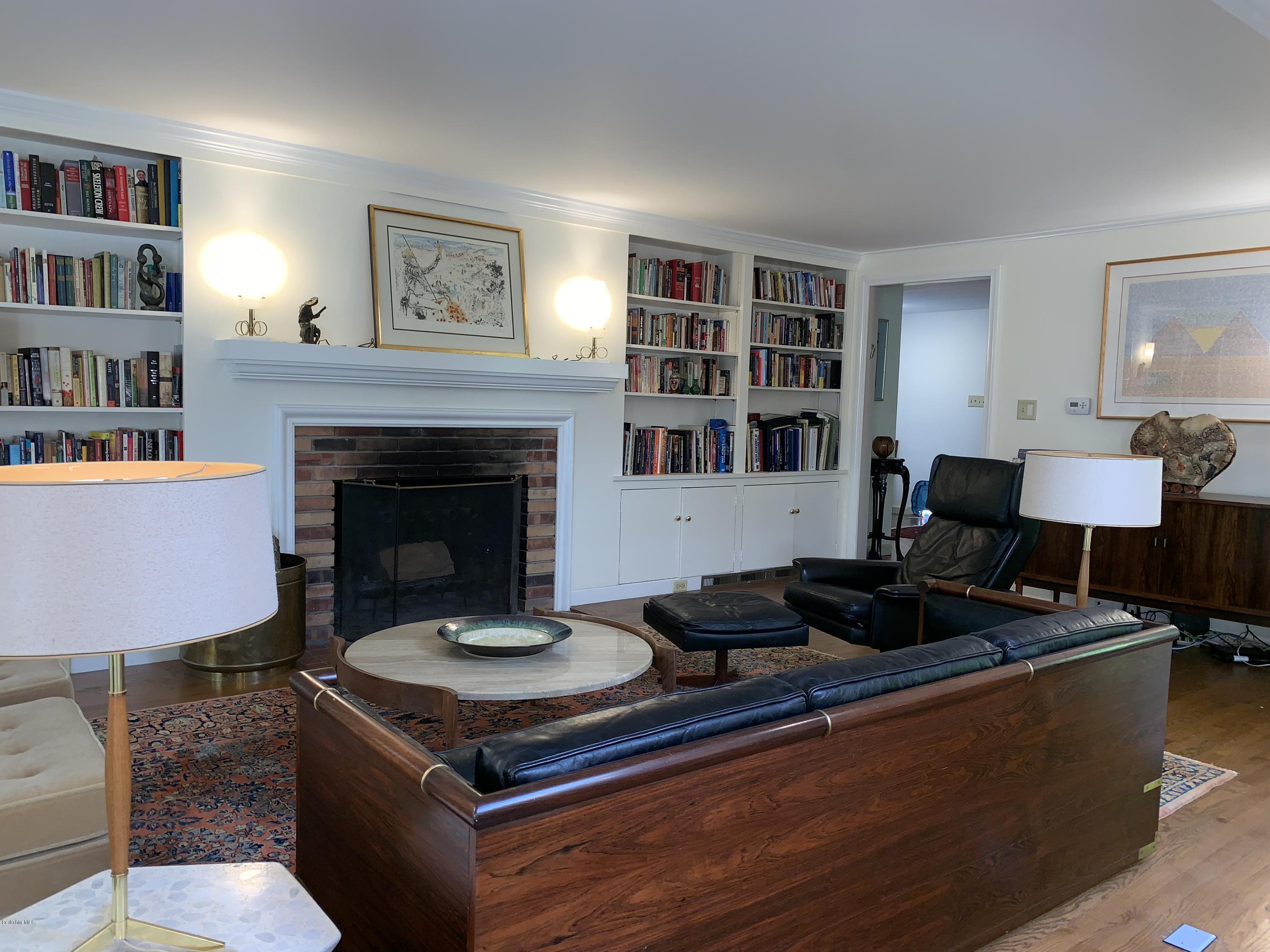 261 Old Stockbridge Road Lenox, MA 01240 - Photo 8 of 43 a living room with furniture and a fireplace