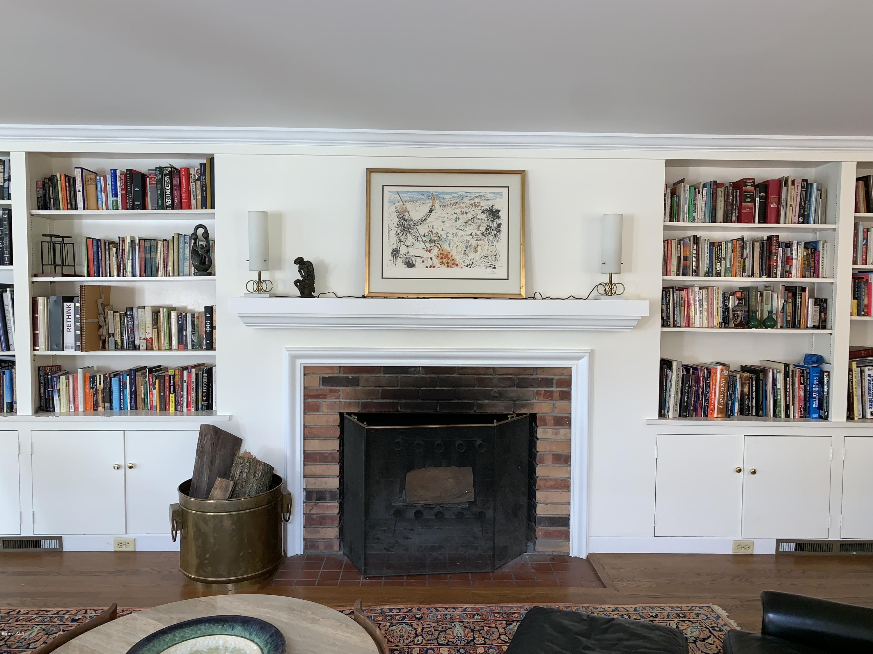 261 Old Stockbridge Road Lenox, MA 01240 - Photo 10 of 43 a living room with furniture and a book shelf