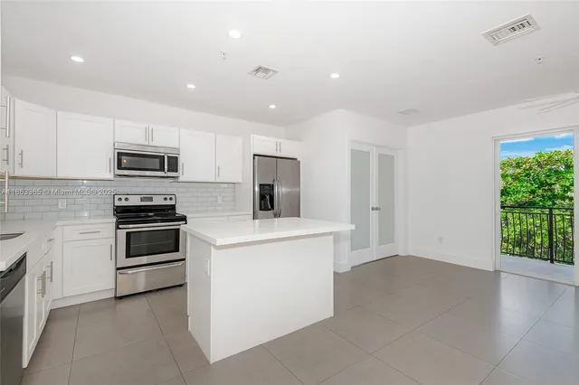 a kitchen with a stove and a microwave