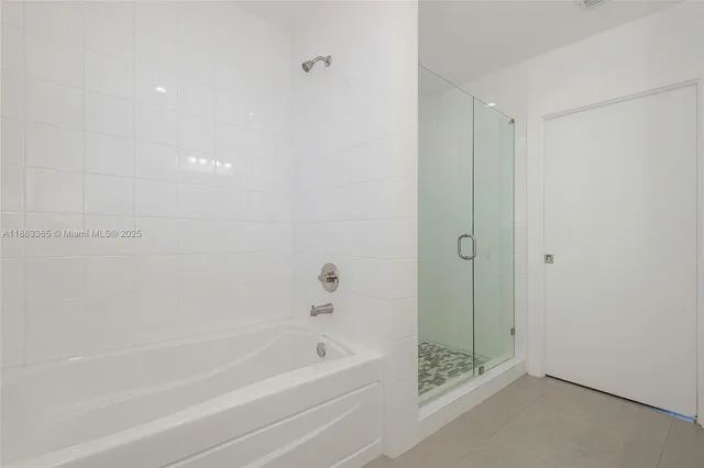 a view of a hallway with washer and dryer