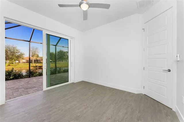 a view of a room with stairs and a ceiling fan