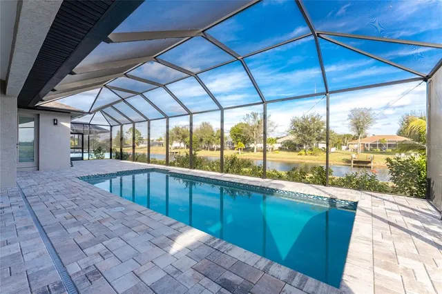 an aerial view of a house with swimming pool