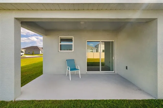 a view of a swimming pool and an outdoor seating