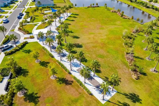 a view of a terrace with swimming pool and sitting area