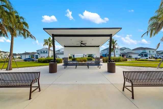 a sign that is sitting on a brick wall