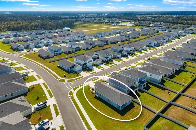 an aerial view of a swimming pool and outdoor space