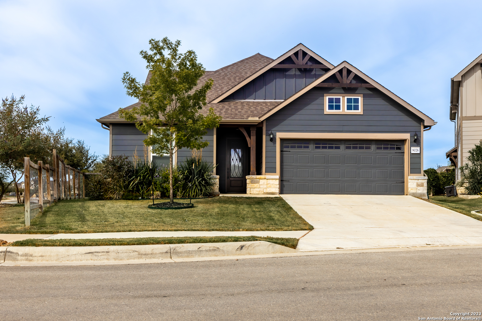 a front view of a house with garden