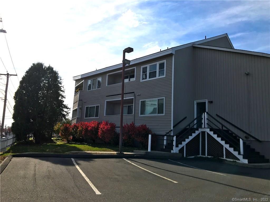 3250 East Main Street, Unit B209 Bridgeport, CT 06606 - Photo 14 of 16 a front view of a house with a yard