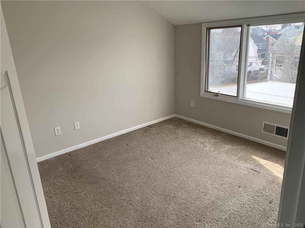 3250 East Main Street, Unit B209 Bridgeport, CT 06606 - Photo 4 of 16 an empty room with a window
