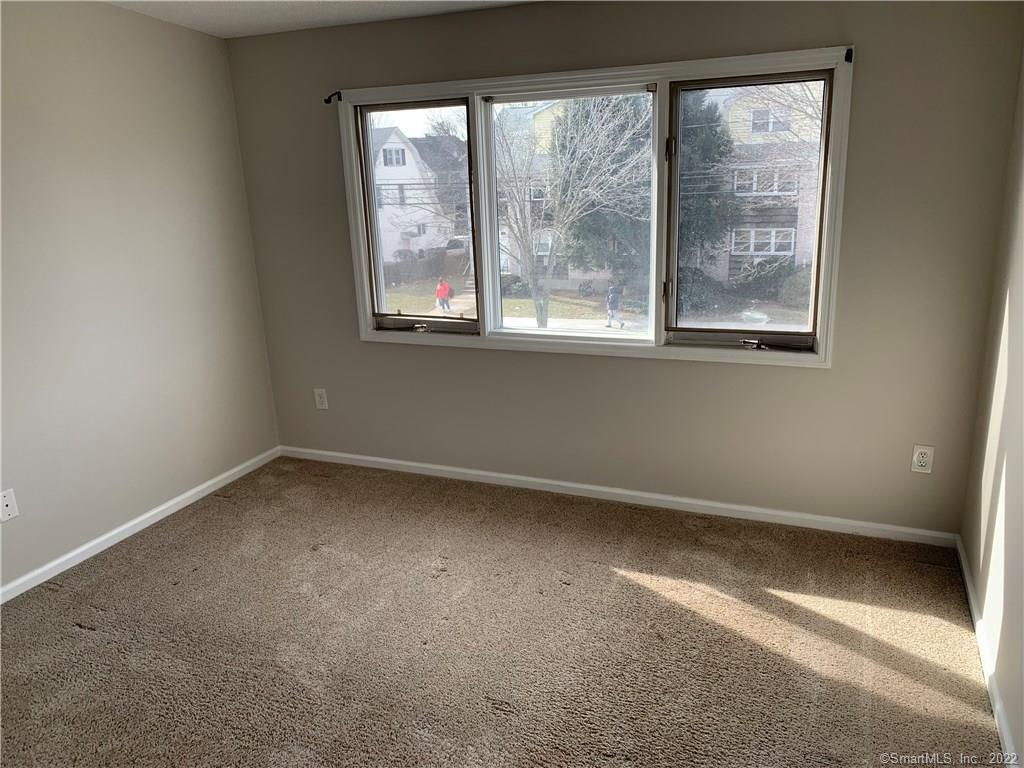3250 East Main Street, Unit B209 Bridgeport, CT 06606 - Photo 9 of 16 an empty room with a window