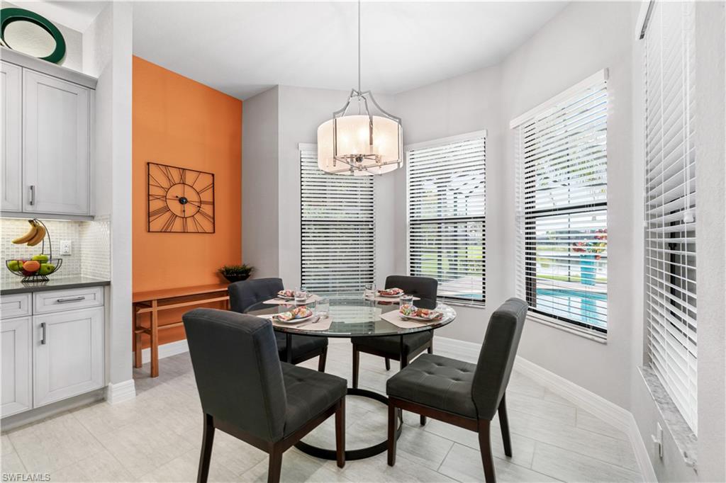 4427 Caldera Circle Naples, FL 34119 - Photo 16 of 50 a view of a dining room with furniture window and outside view