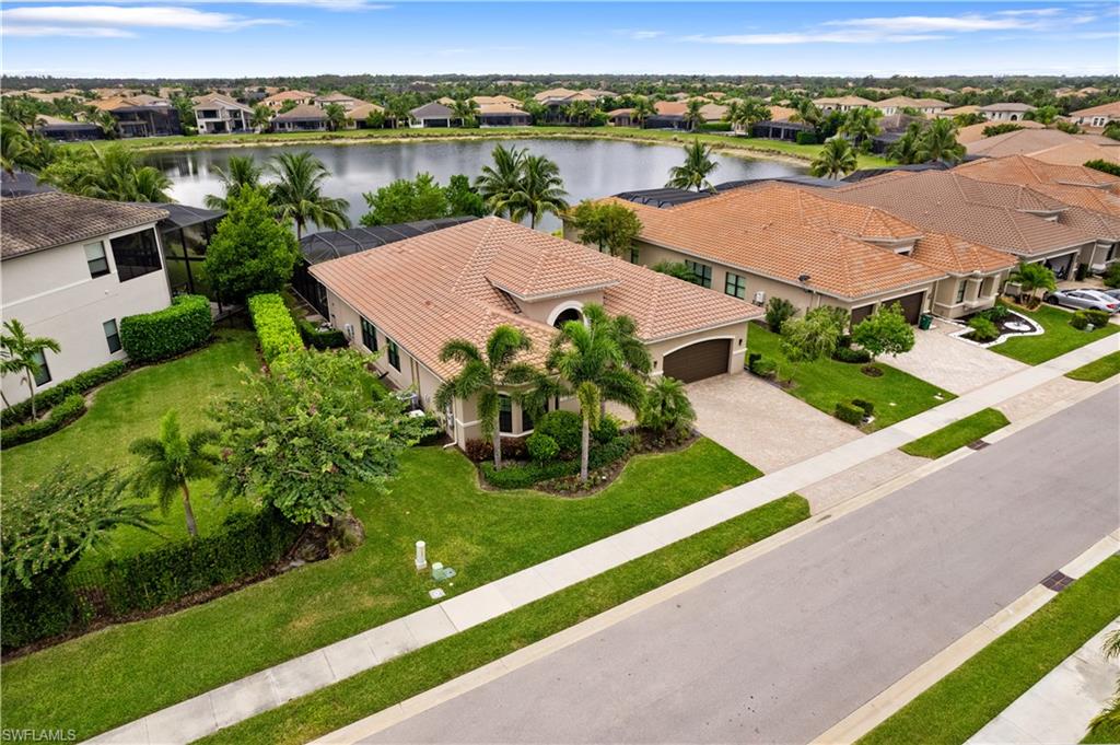 4427 Caldera Circle Naples, FL 34119 - Photo 2 of 50 an aerial view of residential houses with outdoor space and river