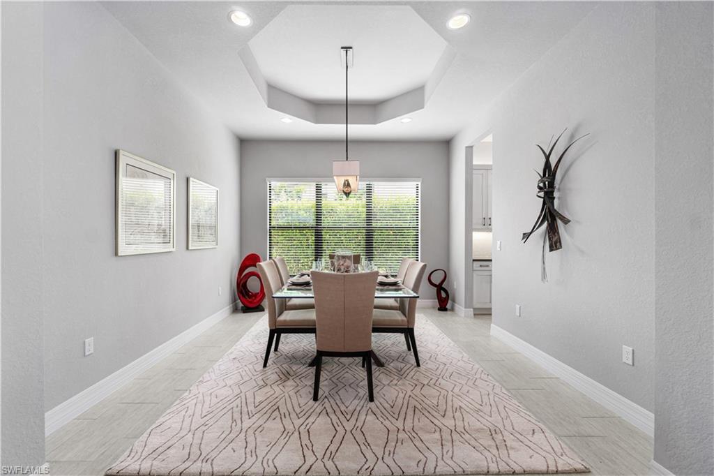 4427 Caldera Circle Naples, FL 34119 - Photo 23 of 50 a living room with furniture and a window