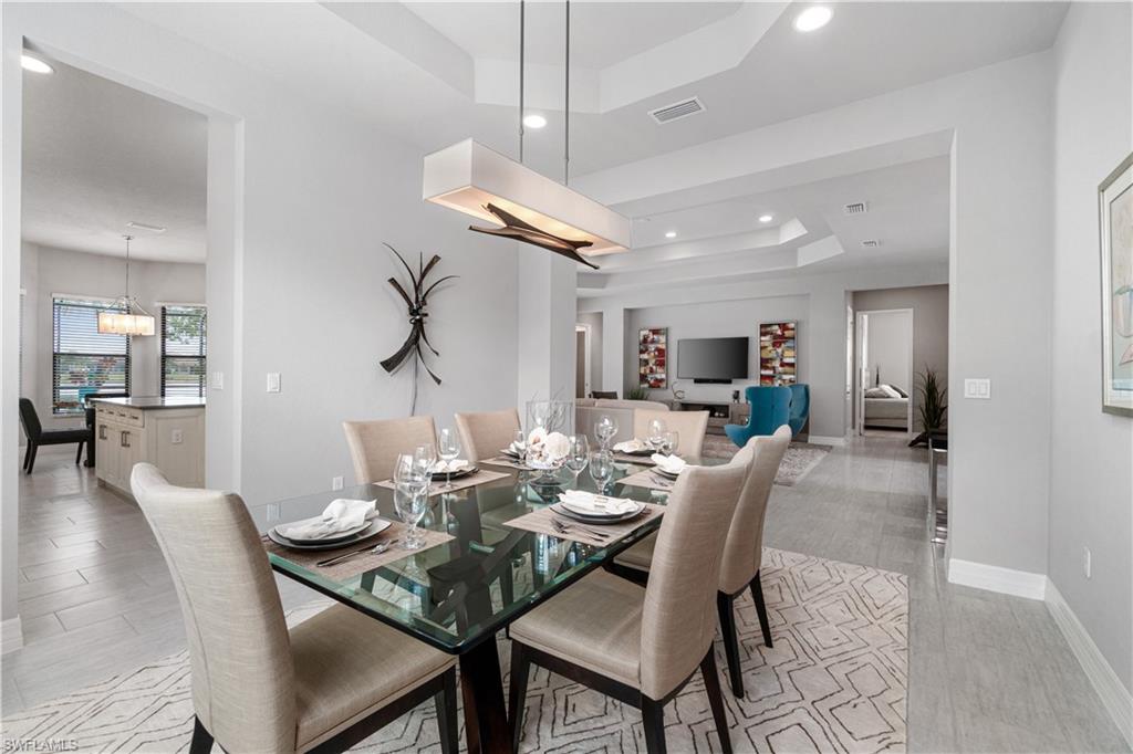 4427 Caldera Circle Naples, FL 34119 - Photo 26 of 50 a view of a dining room with furniture