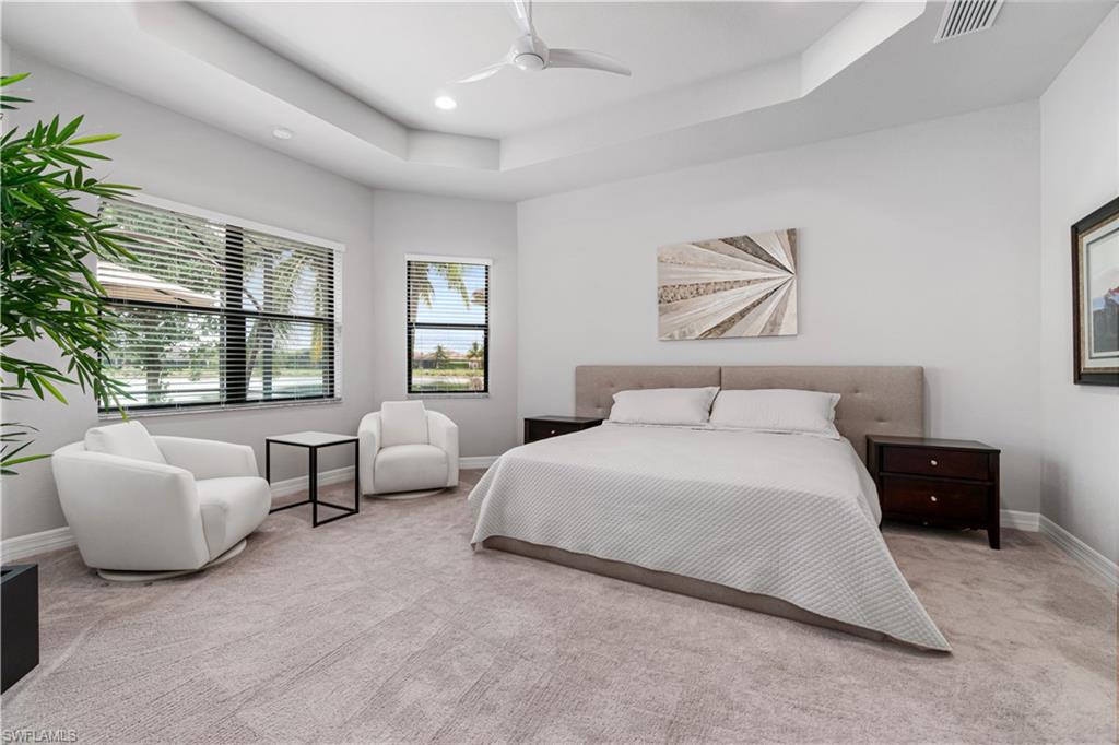 4427 Caldera Circle Naples, FL 34119 - Photo 36 of 50 a bedroom with bed couch and window