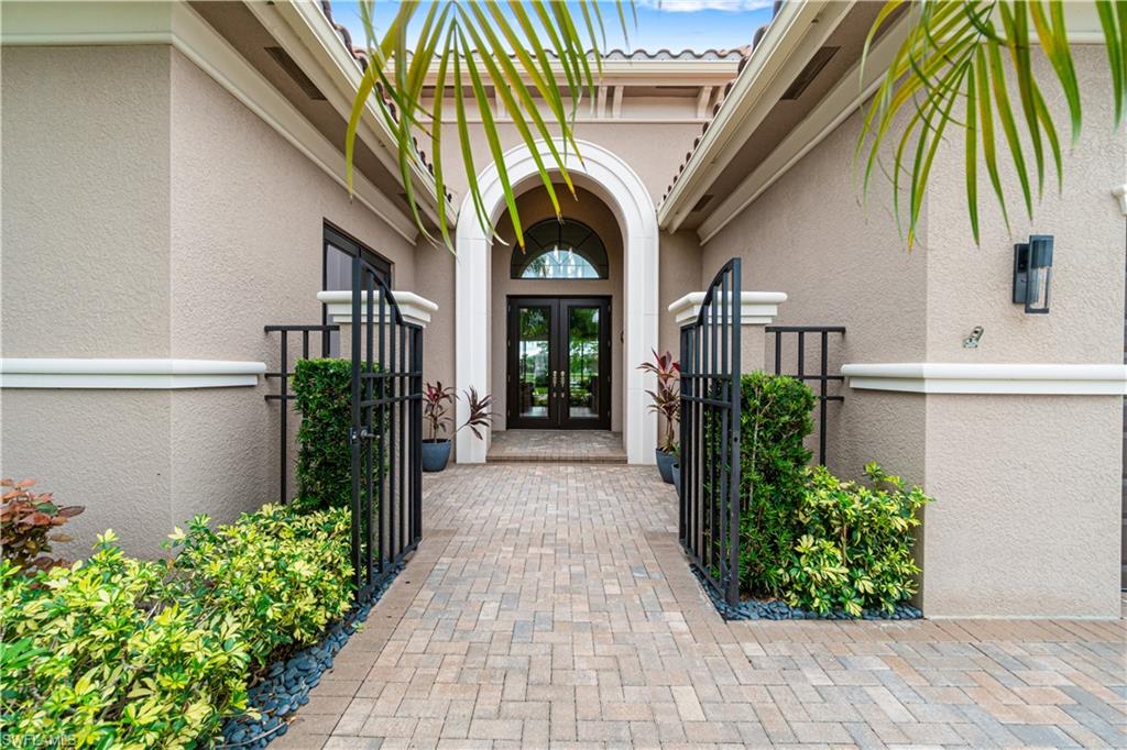 4427 Caldera Circle Naples, FL 34119 - Photo 4 of 50 a entryway view with a garden space