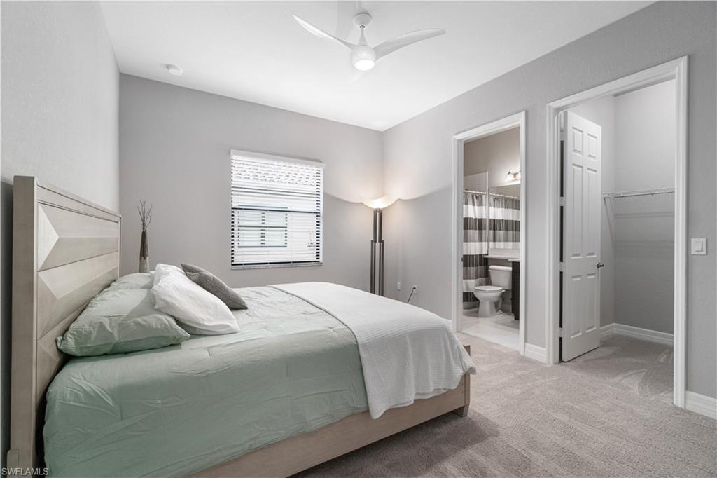 4427 Caldera Circle Naples, FL 34119 - Photo 43 of 50 a bedroom with a bed and a window