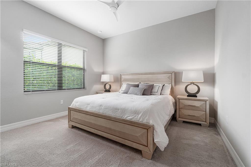 4427 Caldera Circle Naples, FL 34119 - Photo 45 of 50 a bedroom with a bed and window