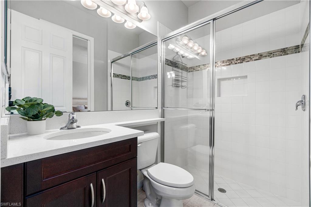 4427 Caldera Circle Naples, FL 34119 - Photo 47 of 50 a bathroom with a sink toilet and shower