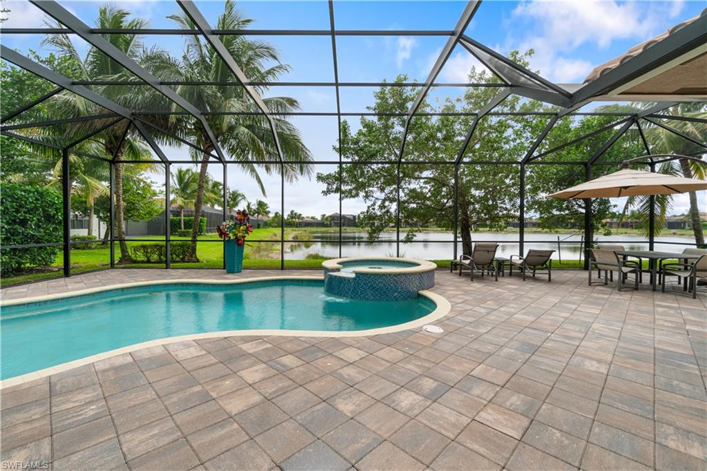 4427 Caldera Circle Naples, FL 34119 - Photo 50 of 50 a view of a swimming pool with a patio