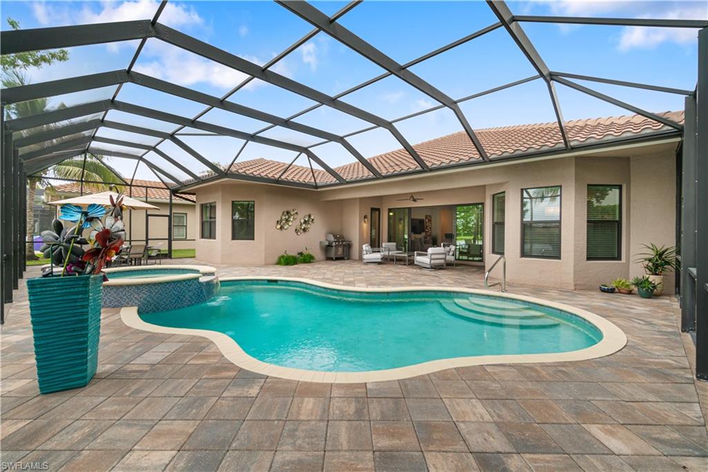 4427 Caldera Circle Naples, FL 34119 - Photo 8 of 50 a view of a house with swimming pool