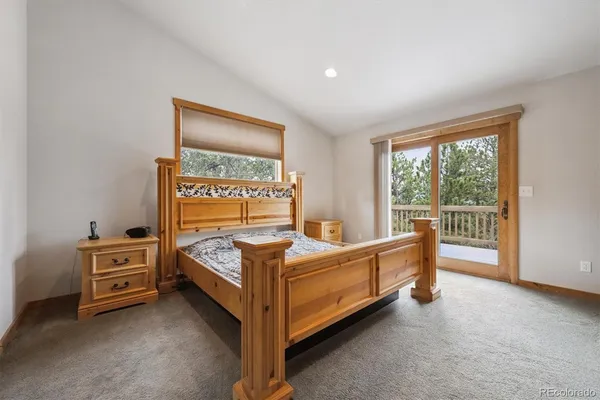 a bed room with a bed and a window