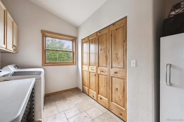a view of a storage & utility room with a window