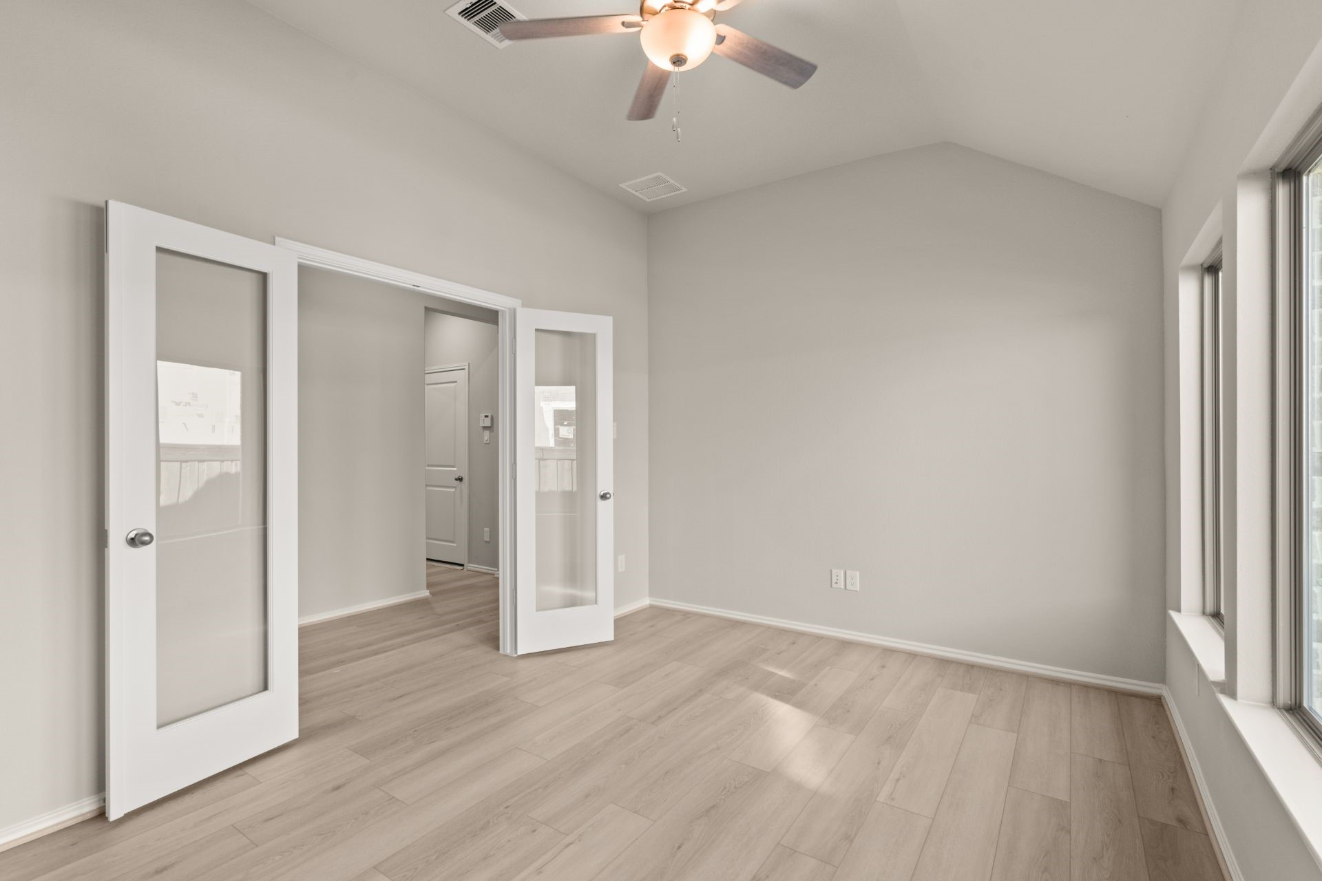 9170 Grand Jubilee Drive Montgomery, TX 77316 - Photo 5 of 18 wooden floor in an empty room with a window