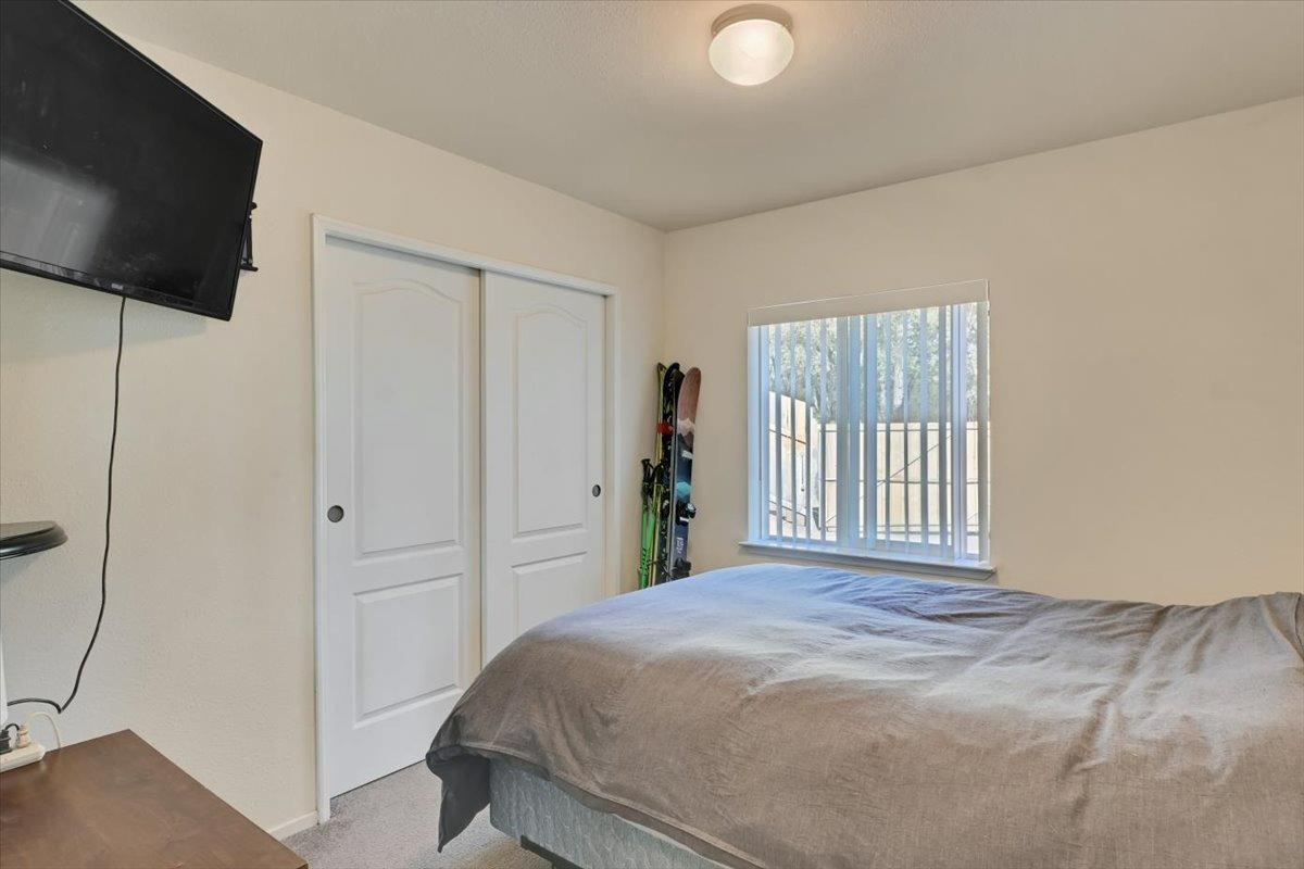 Undisclosed Address Grass Valley, CA 95949 - Photo 13 of 26 a bedroom with a bed and a flat screen tv