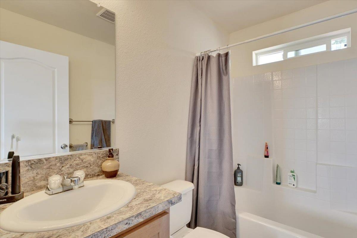 Undisclosed Address Grass Valley, CA 95949 - Photo 16 of 26 a bathroom with a granite countertop sink and a mirror