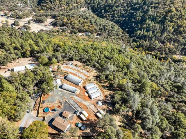 an aerial view of residential house with parking space