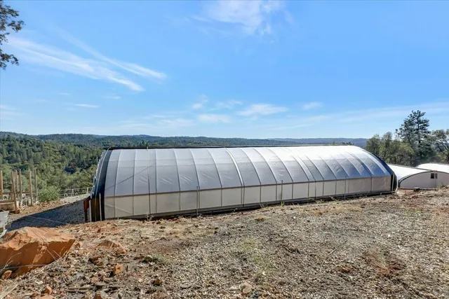 a view of a backyard of the house