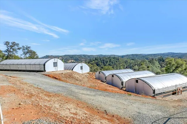 a view of balcony with outdoor seating and city view