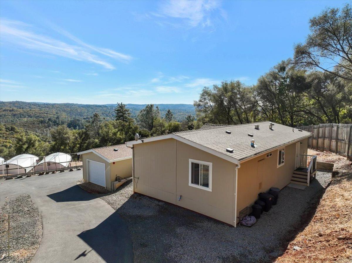 Undisclosed Address Grass Valley, CA 95949 - Photo 4 of 26 a view of a white house with a outdoor space