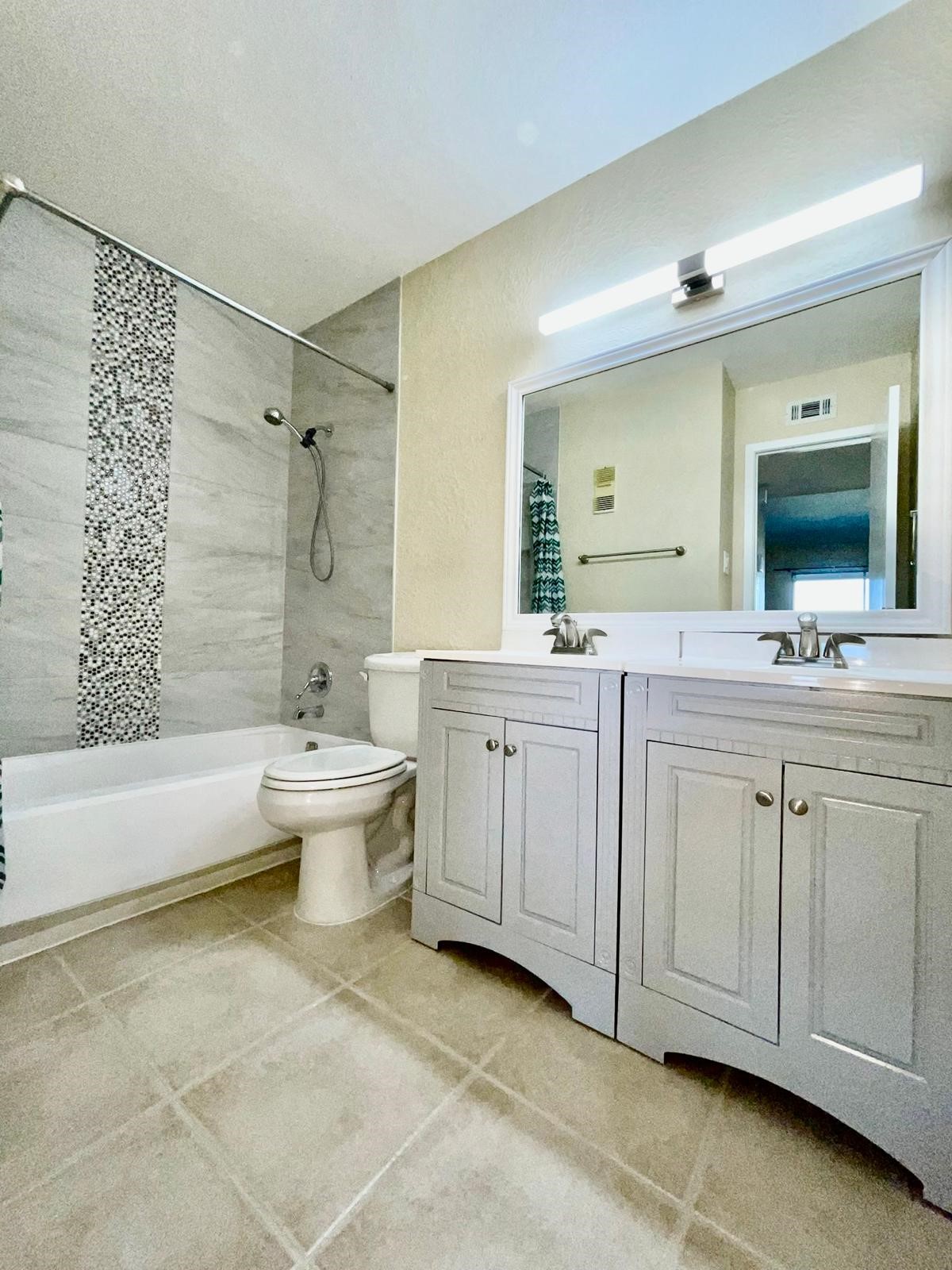 En-suite main bathroom, easy access from main bedroom. Fully remodeled.