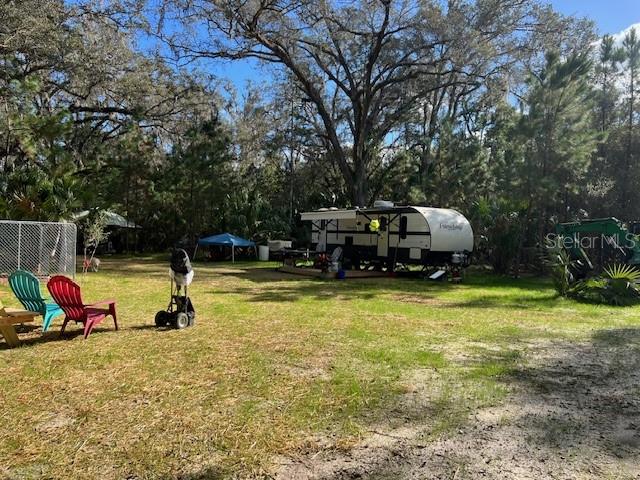 9600 Northeast 90th Street Road Fort McCoy, FL 32134 - Photo 31 of 32 a view of a swimming pool with a slide