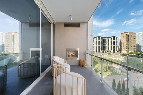a view of a balcony with furniture