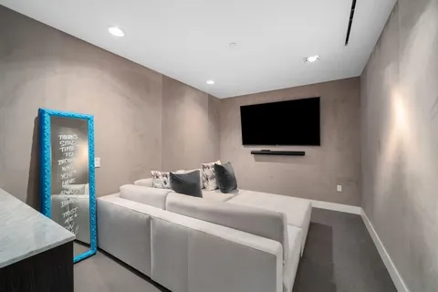 a room with a bed and a flat screen tv