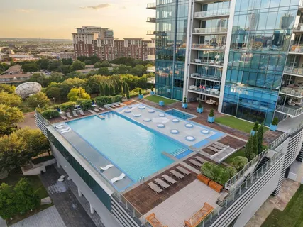 an aerial view of a residential apartment building with a yard