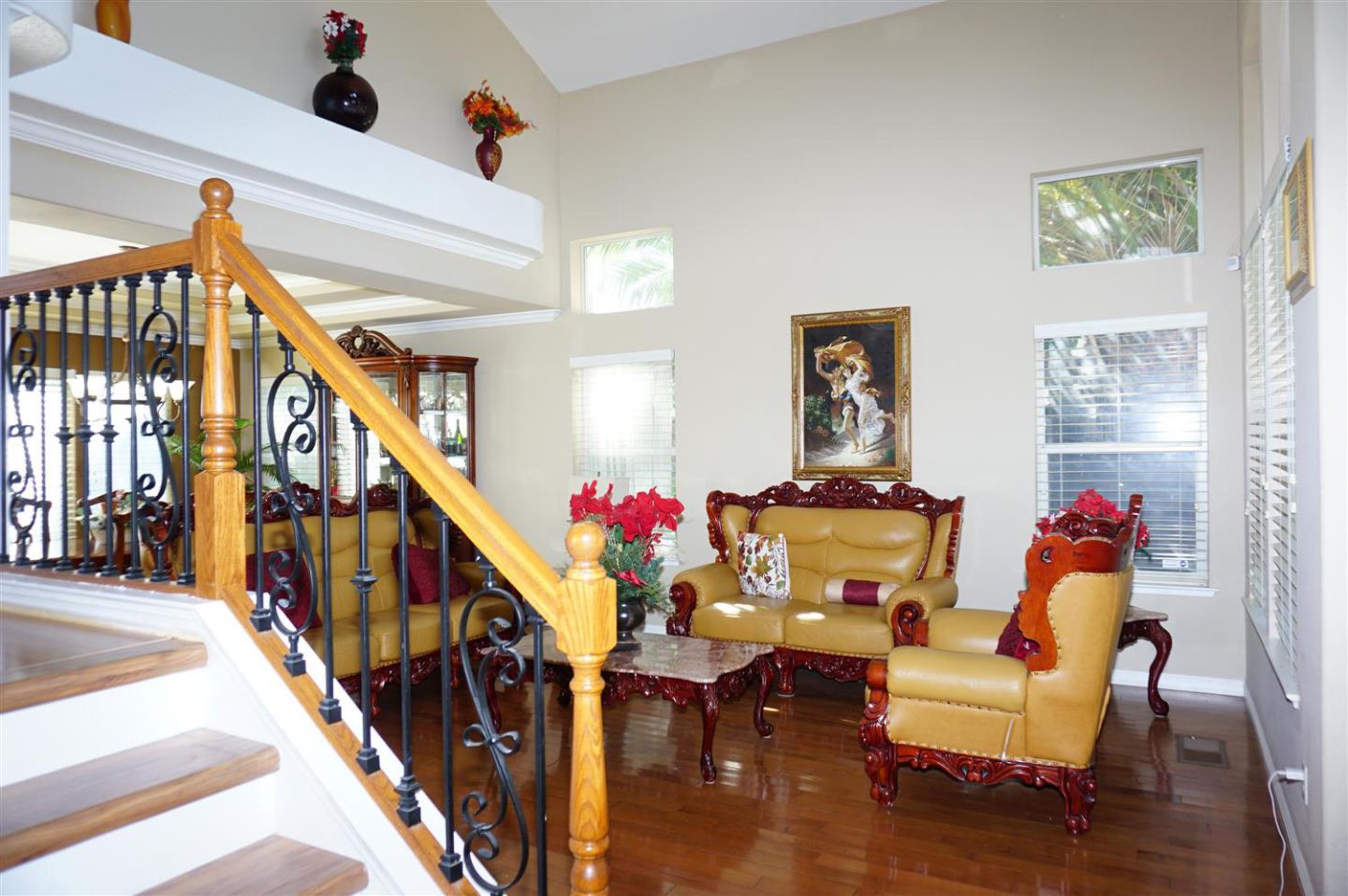 9402 Rodeo Drive Gilroy, CA 95020 - Photo 12 of 22 a living room with furniture and stairs