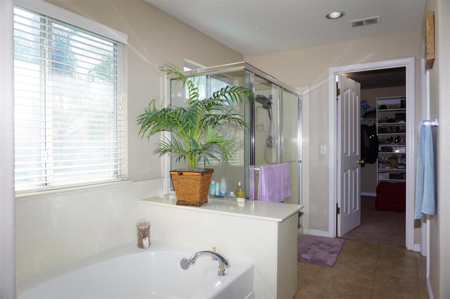 9402 Rodeo Drive Gilroy, CA 95020 - Photo 15 of 22 a bath room with a sink and a tub