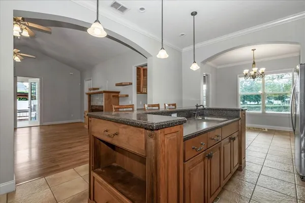 an empty room with wooden floor and fireplace