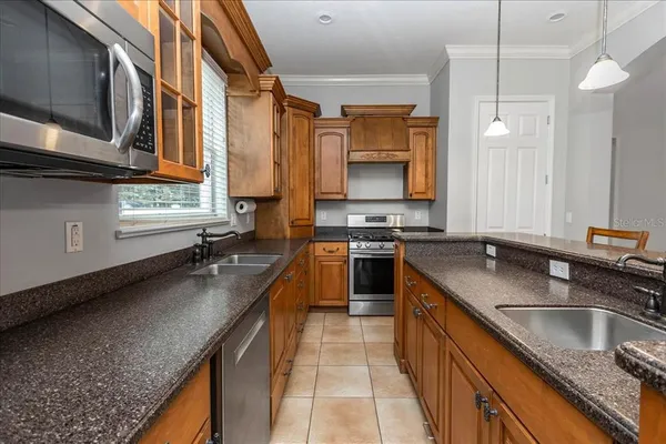 a bathroom with a granite countertop toilet sink and shower